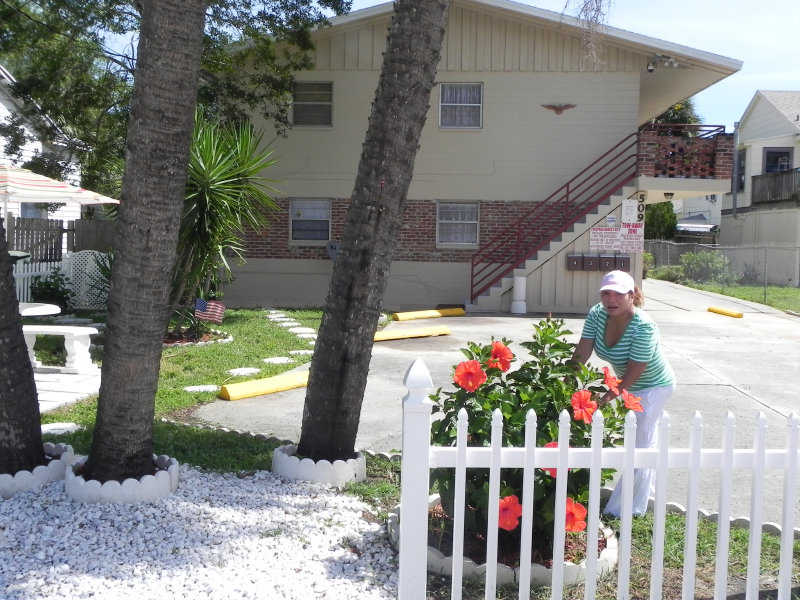 Beautiful Linda Attends the flowers. Secrete Flower Garden In The Back!!